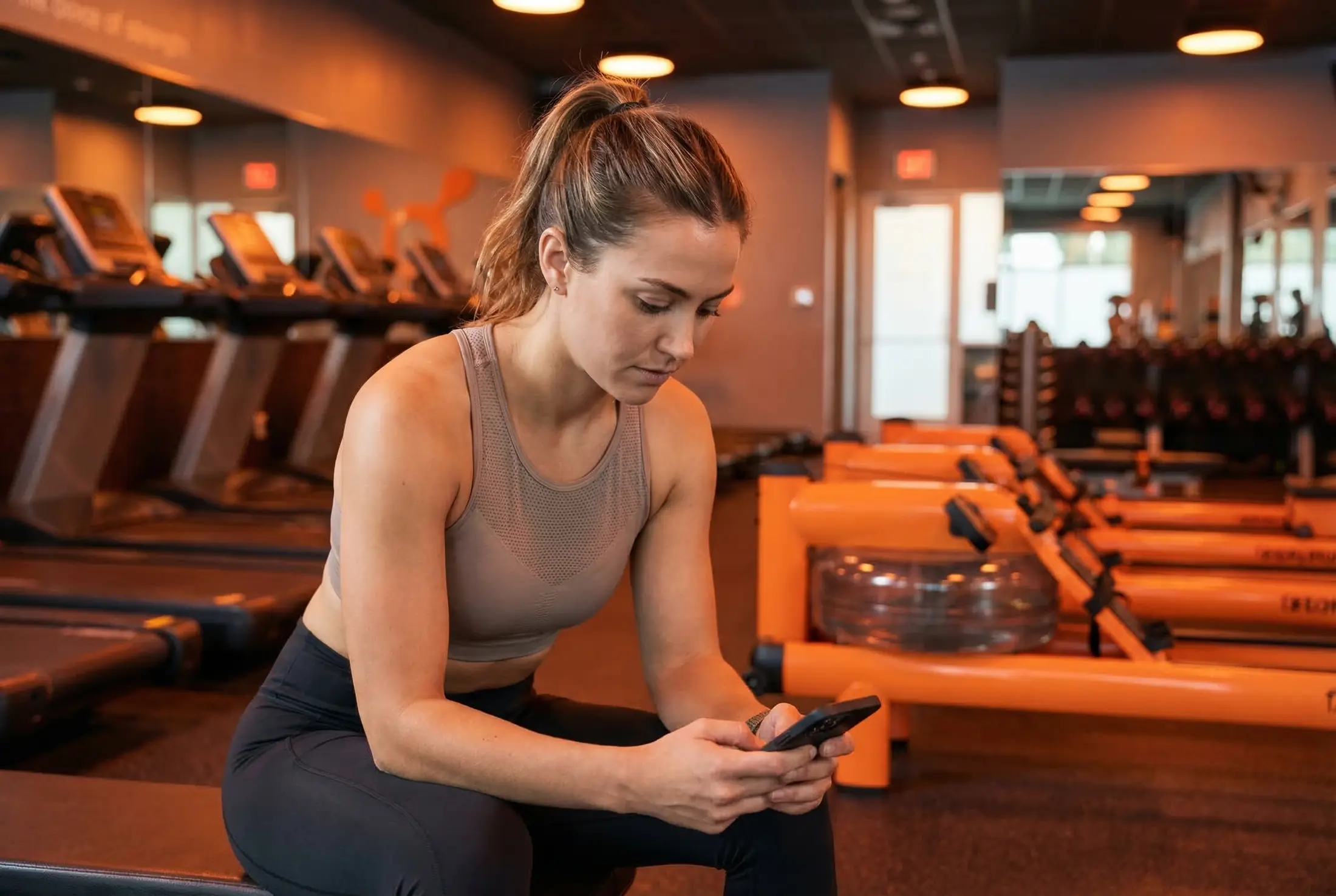 Athlete reviewing Burn Board on a phone after class.